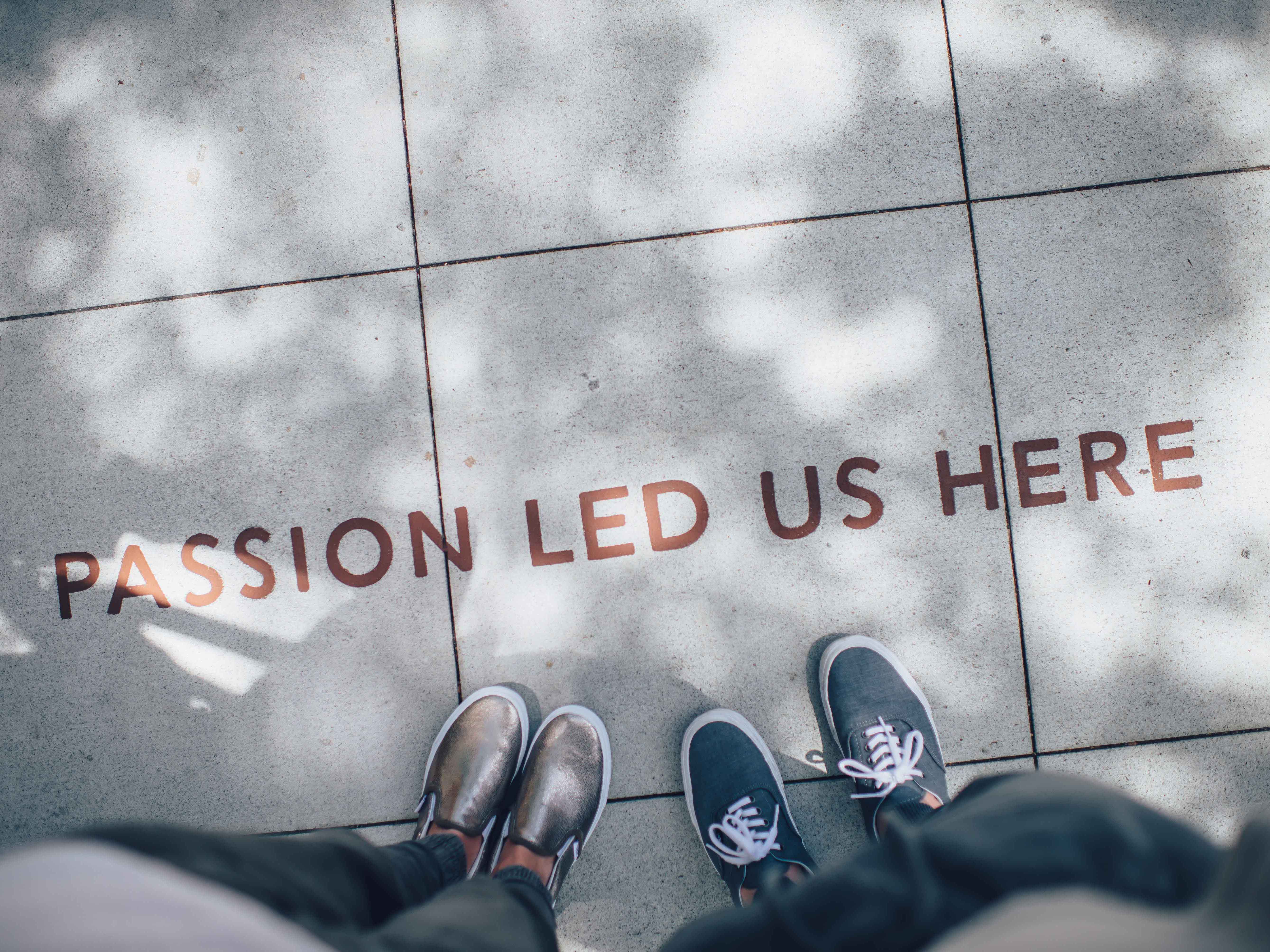 Passion Led Us Here written on sidewalk