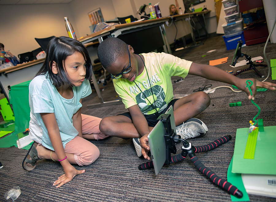 boy and girl work on an unplugged computing activity together