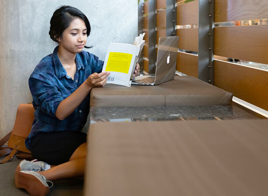 girl reads a book and studies