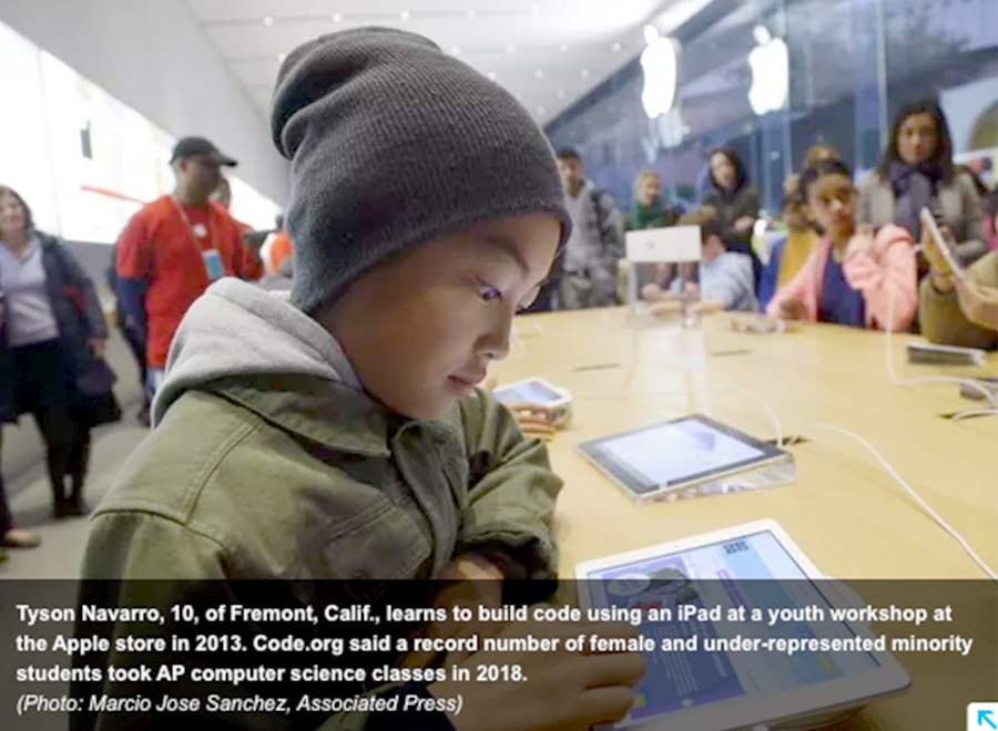 Boy learns to code using an app on an iPad