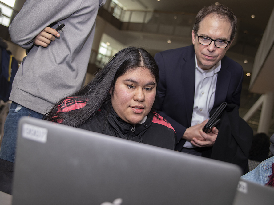 Student shows project to donor.