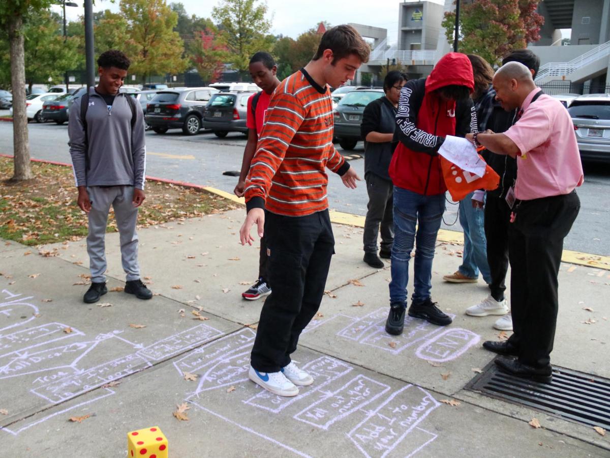 Students participate in unplugged hopscotch activity