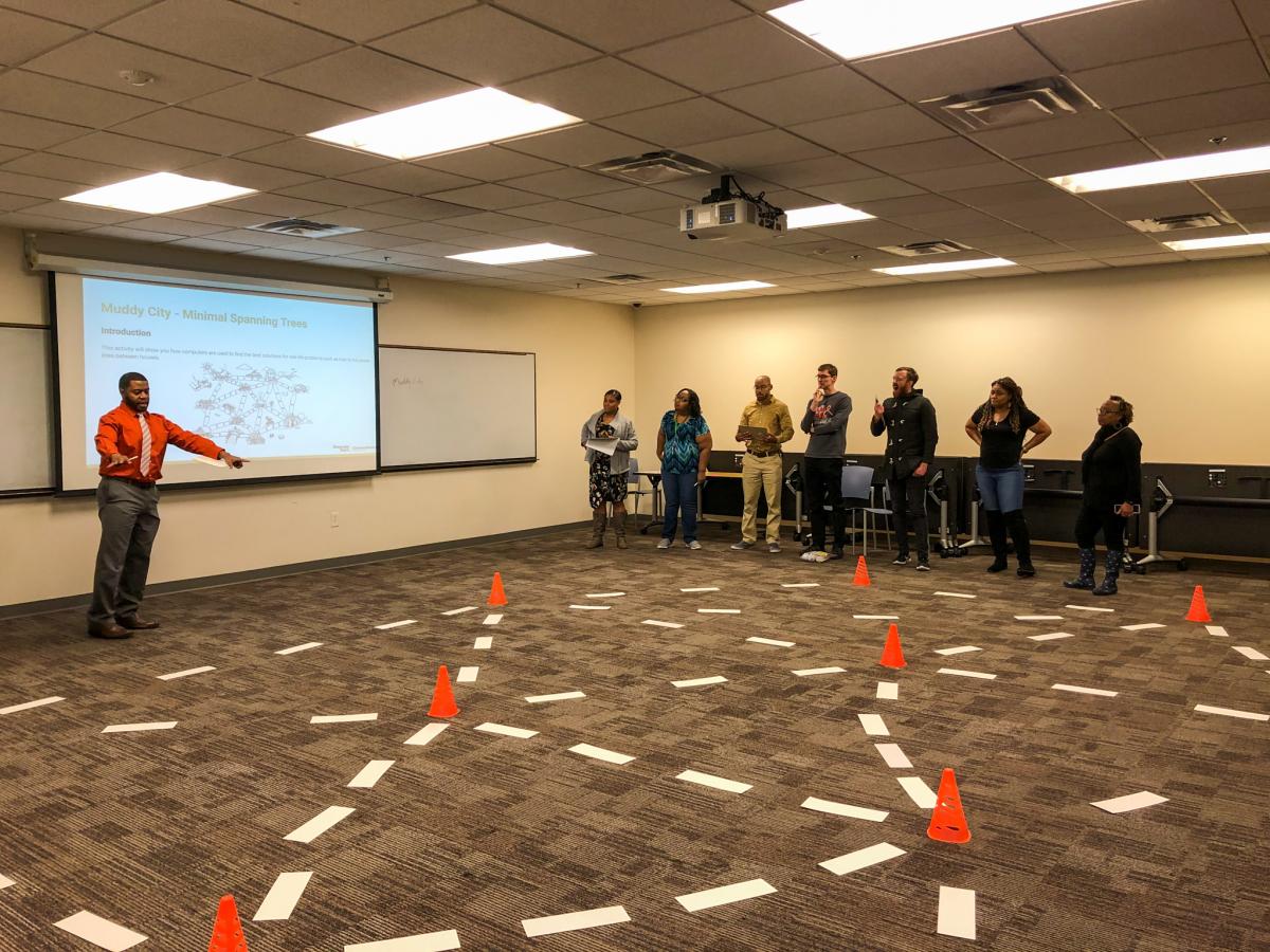 Terry Foster explains Spheros and the task at hand to participating teachers.