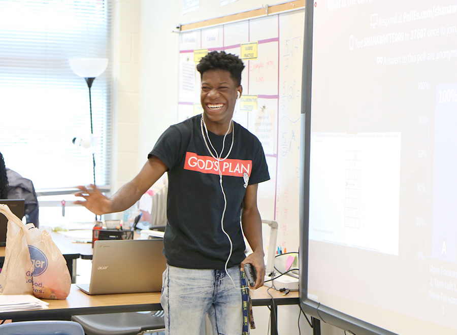 Boy laughs in class